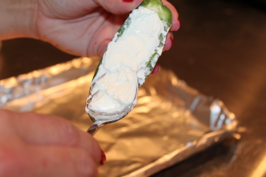 Fill the jalapeno cavity with cream. cheese. Reduced fat can be used.